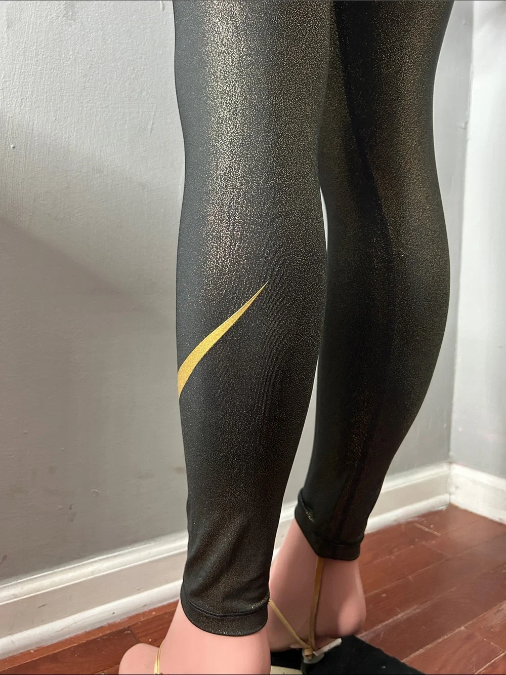 Nike Women’s Black Leggings with Gold Accent